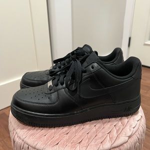 Black low Nike Air Force 1’s